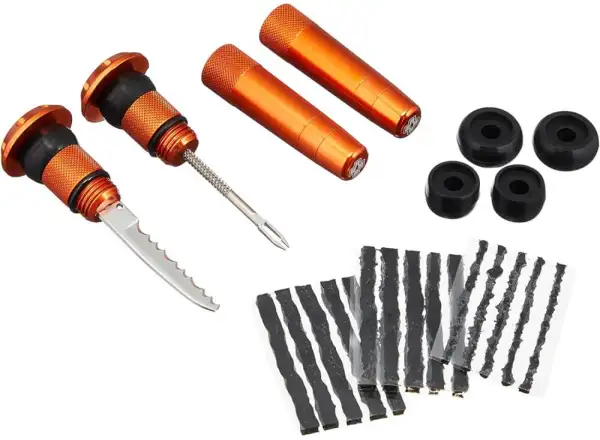 Muc-Off Stealth Tubeless Puncture Plug repair kit into handlebars