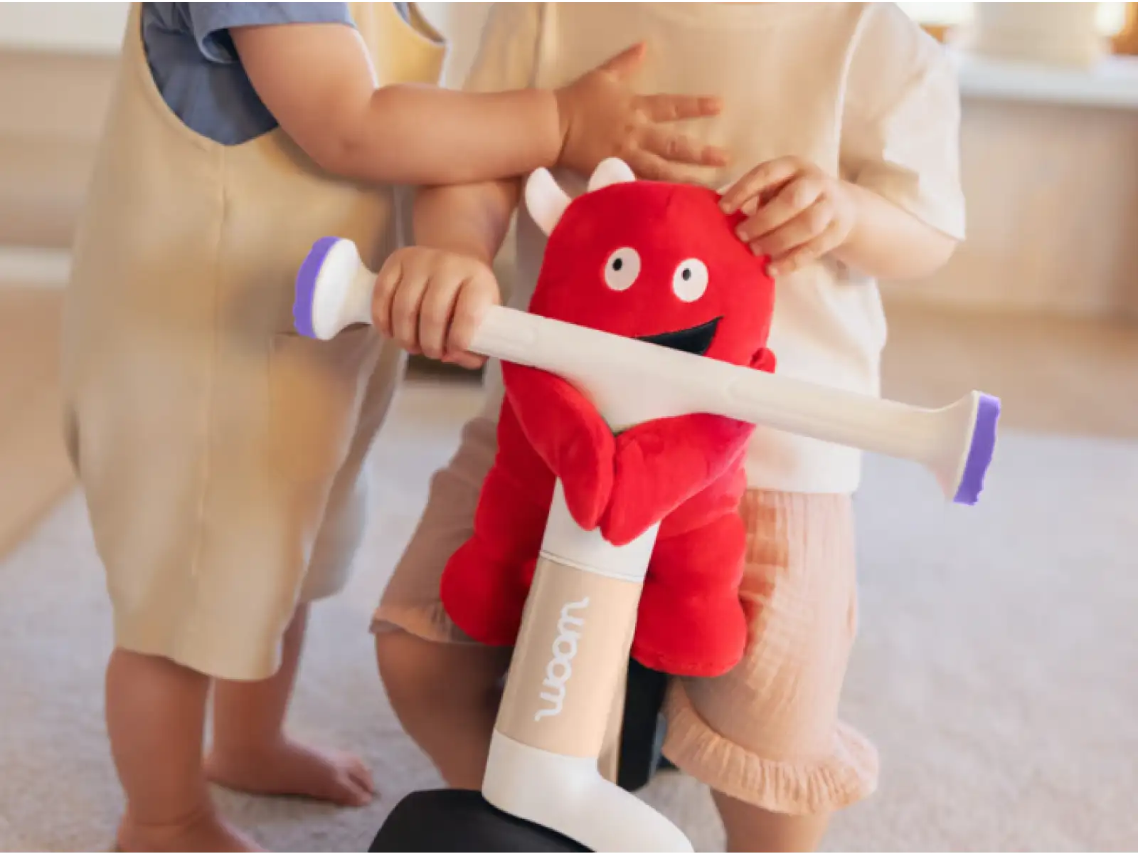 Woom WOW children's balance bike Pop Peach